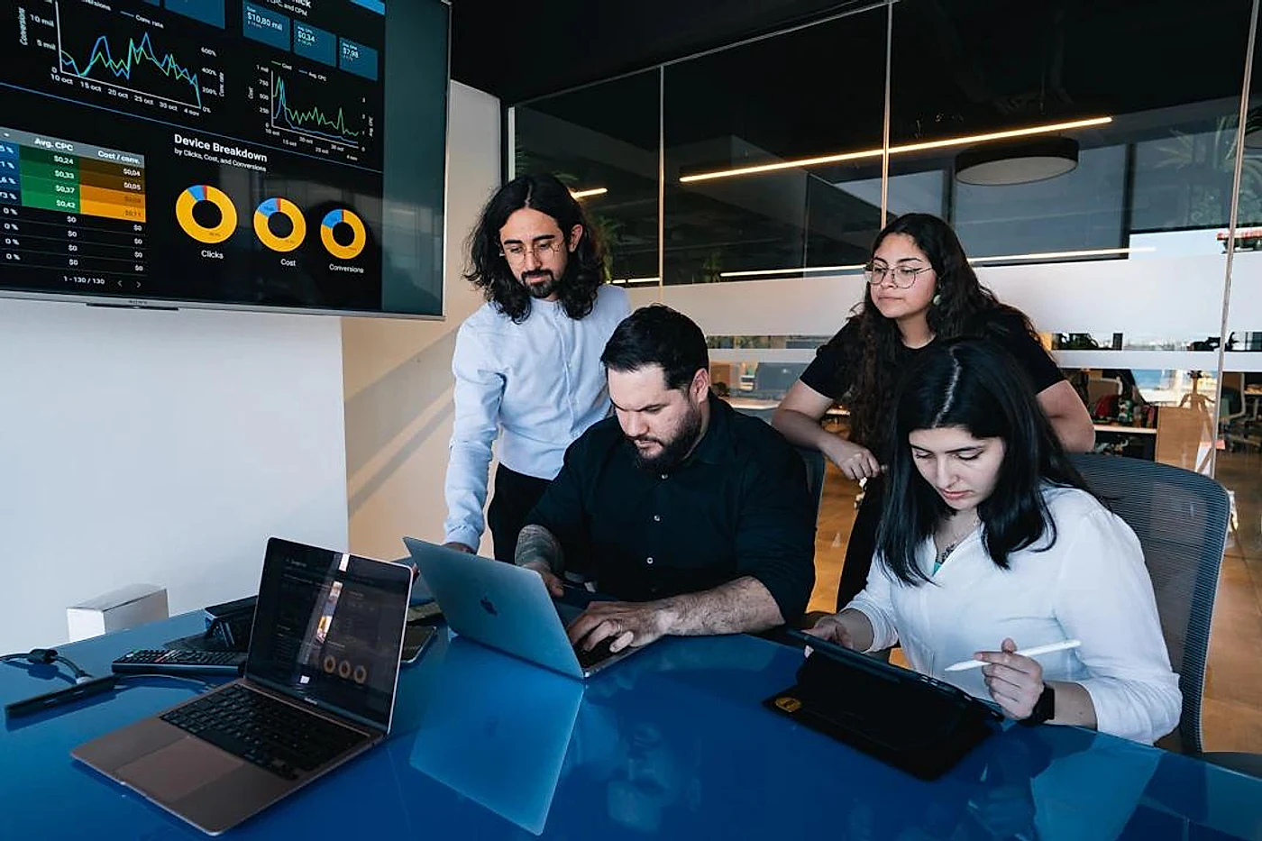 Digital marketing team analyzing campaign performance and online lead generation data